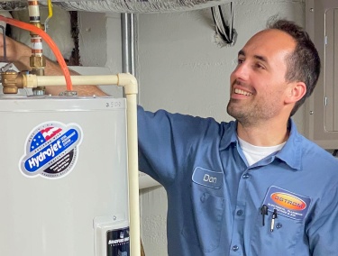 Ostrom plumber servicing a water heater