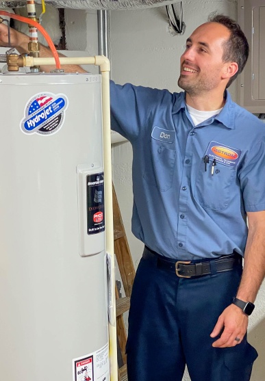 Ostrom plumber servicing a water heater