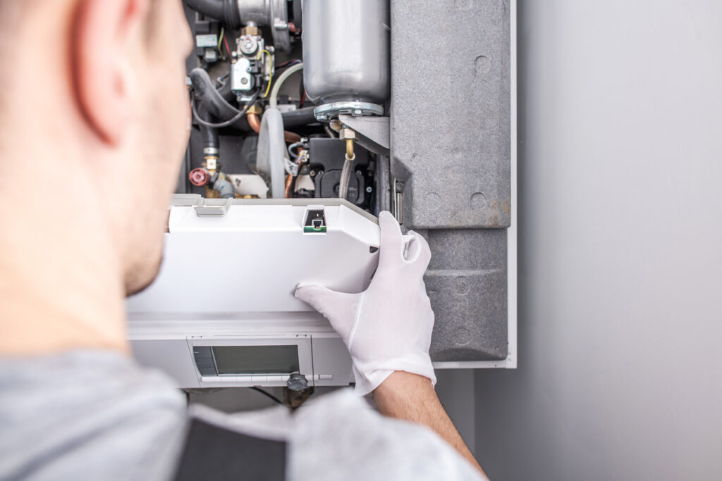 technician opening a furnace