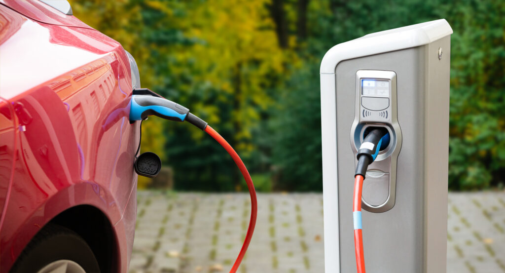 EV charger charging a red car